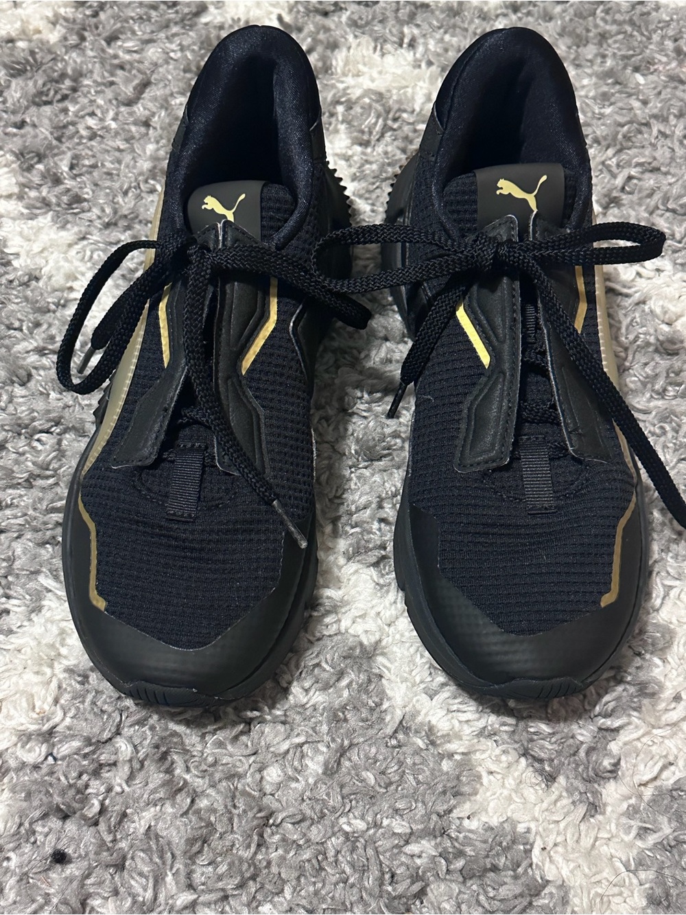 Puma Black Sneakers with Gold Detailing